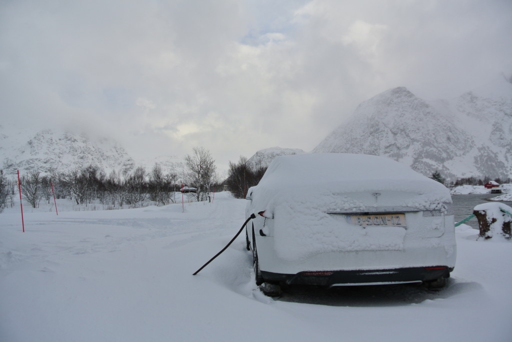 Car under snow from back